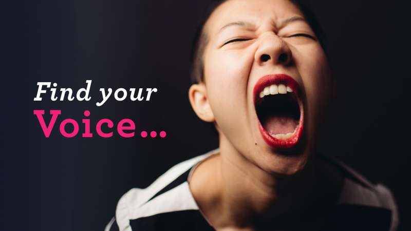 A young Asian woman defiantly shouting toward the camera. Image text: Find your voice.
