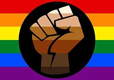 Image of a Pride flag with BLM fist in the center.