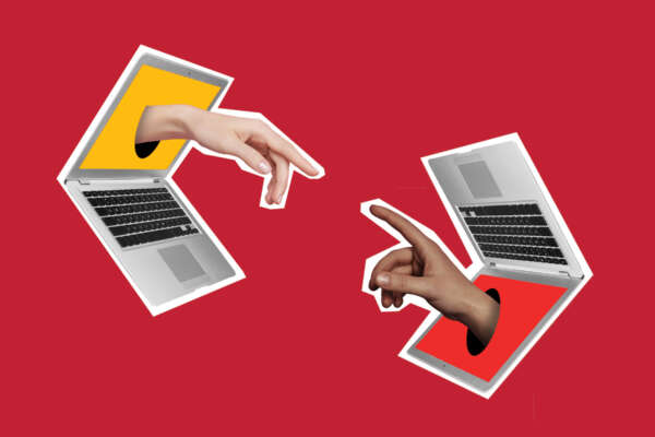 two laptop two hands reaching out of the screens toward each other