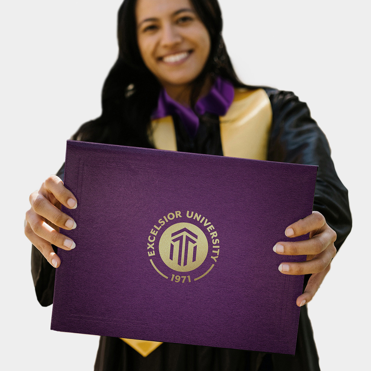 young woman holding diploma